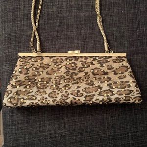 Leopard and gold dressy clutch with straps.